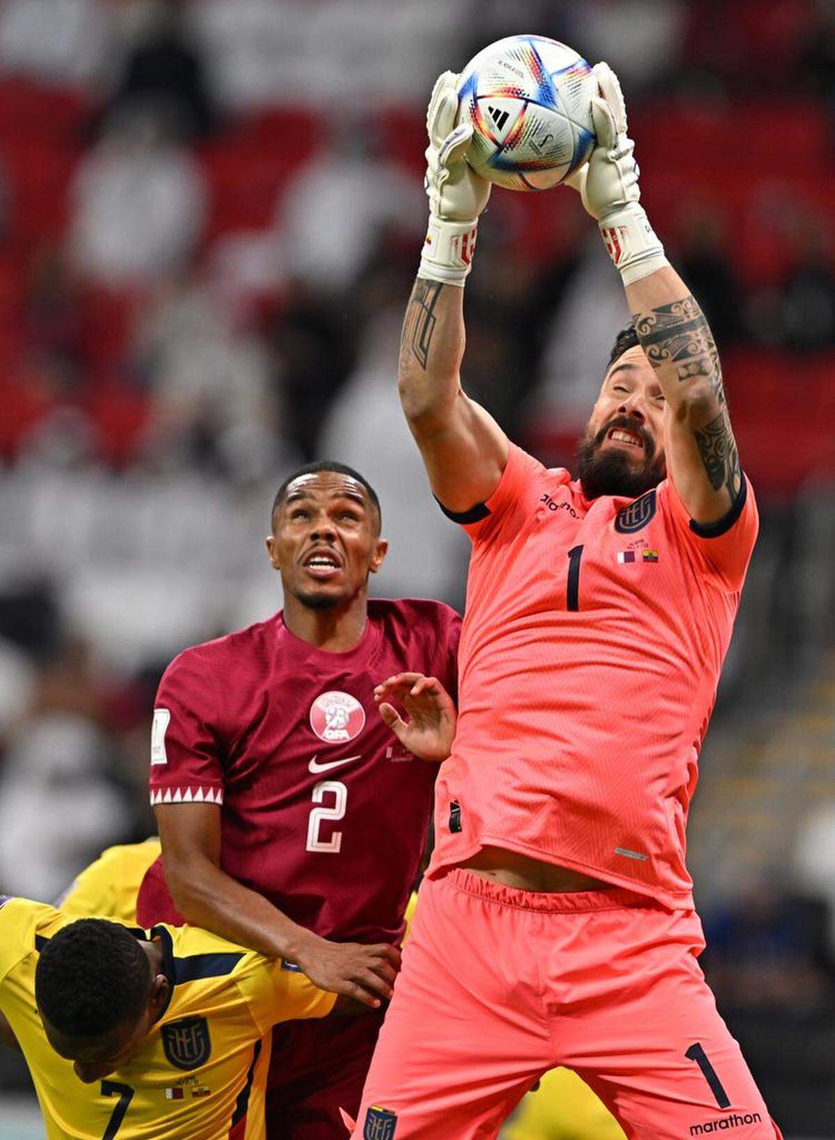 Goalkeeper Hernán Galndez of Ecuador in action against Pedro Miguel (C) of Qatar during the FIFA World Cup 2022 group A Opening Match between Qatar and Ecuador at Al Bayt Stadium in Al Khor.