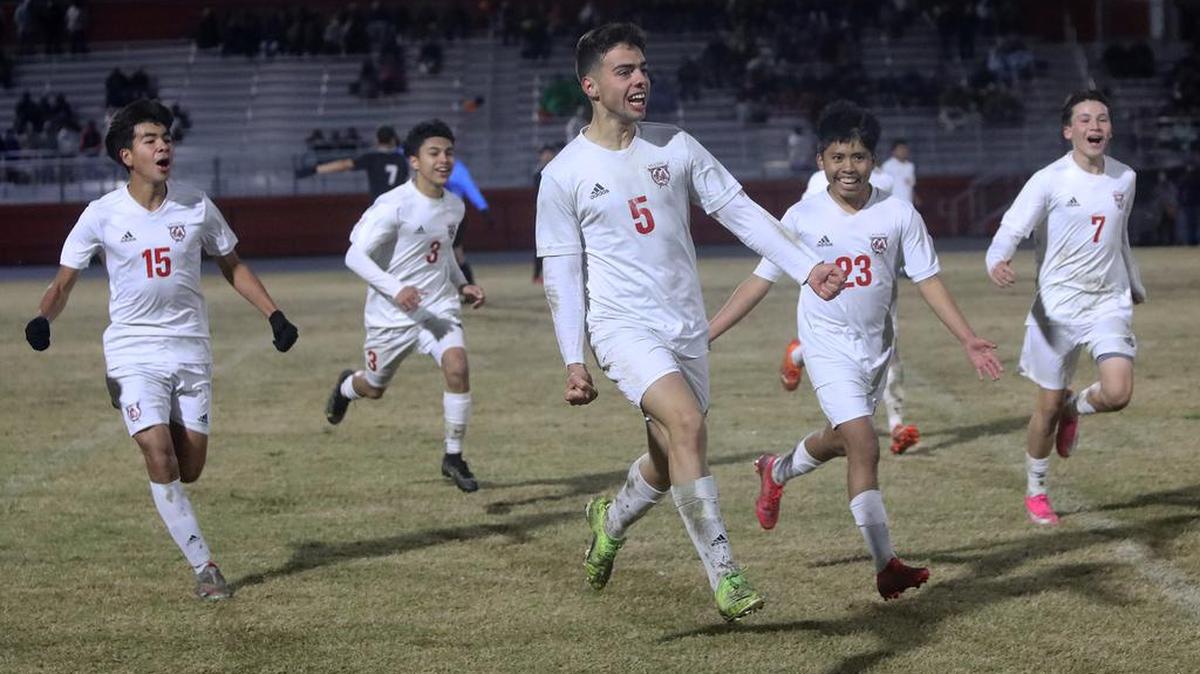McLane High senior forward Lautaro 'Tino' Donoso celebrates his second goal of the game against Selma along with teammates Ángel Mejía (15) and Diego Méndez (23). The ninth-seeded McLane team won 4-1 to advacne to the CIF Central Section Division IV championship Friday (Feb. 25) against No. 3 seed Fowler High.