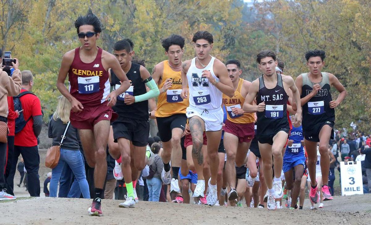 Glendale College freshman Ethan Danforth leads the pack past the mile mark of the four-mile course at Woodward Park during the California Community College cross country championships on Nov. 20, 2021.