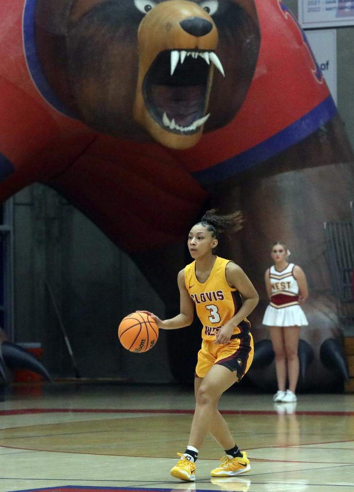 Clovis West senior Monaysiah Young dribbles the ball during a 70-42 TRAC win over host Buchanan High on Jan. 20, 2023.
