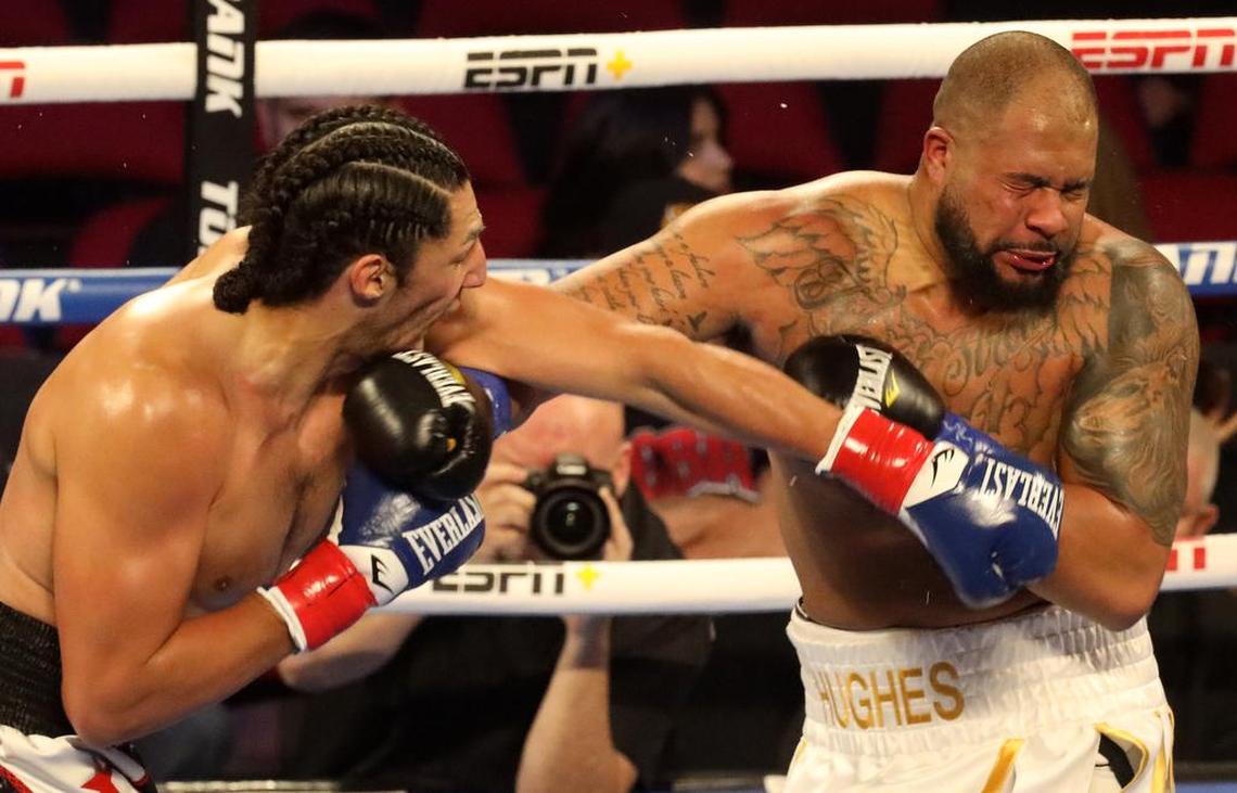 Anthony ‘El Gigante’ Mireles of Iowa lands a left punch against Brandon Hughes of Alabama in a heavyweight bout at the Save Mart Center on March 4, 2022.