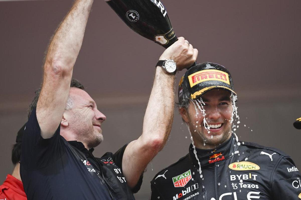 .Mexican Formula One driver Sergio Pérez (R) of Red Bull Racing celebrates with team chief Christian Horner (L) on the podium after winning the Formula One Grand Prix of Monaco at the Circuit de Monaco in Monte Carlo, Monaco.