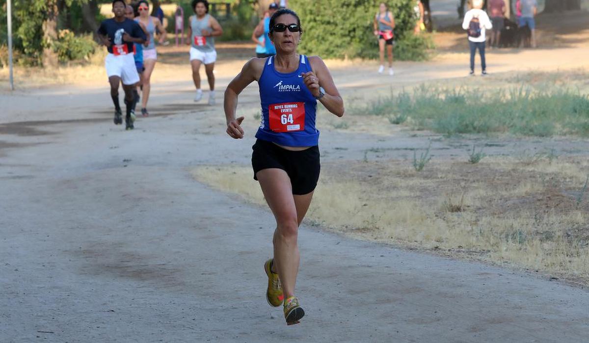 Miguel Reyes 5k race on July 25, 2021 at Woodward Park: Juliet Wahleithner, first female masters in 20:05.3.