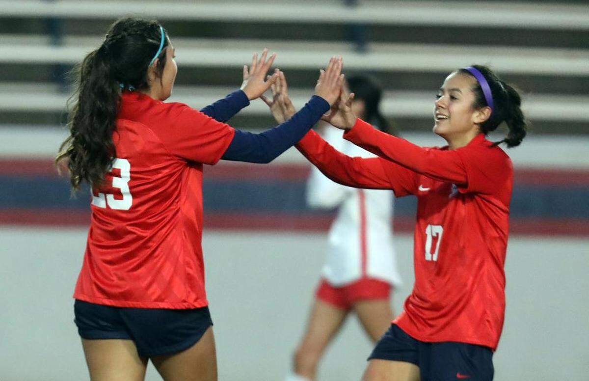 Ariana Ávalos of Sanger congratulates teammate Ava Martínez on her goal against San Joaquín Memorial during a Jan. 27, 2023 CMAC match at Tom Flores Stadium. Sanger won, 4-2, to improve to 5-0-1 in league play.