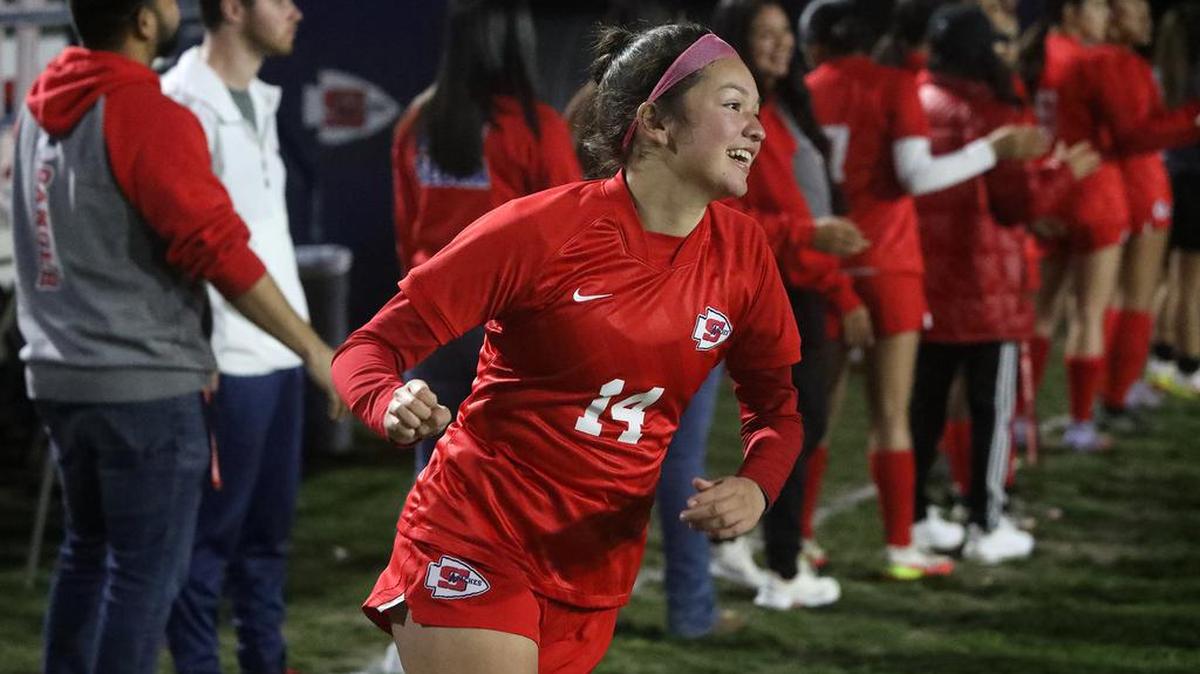 Sanger High senior Diana García is all smiles after being introduced prior to the CIF Central Section Division II match against St. Joseph’s.