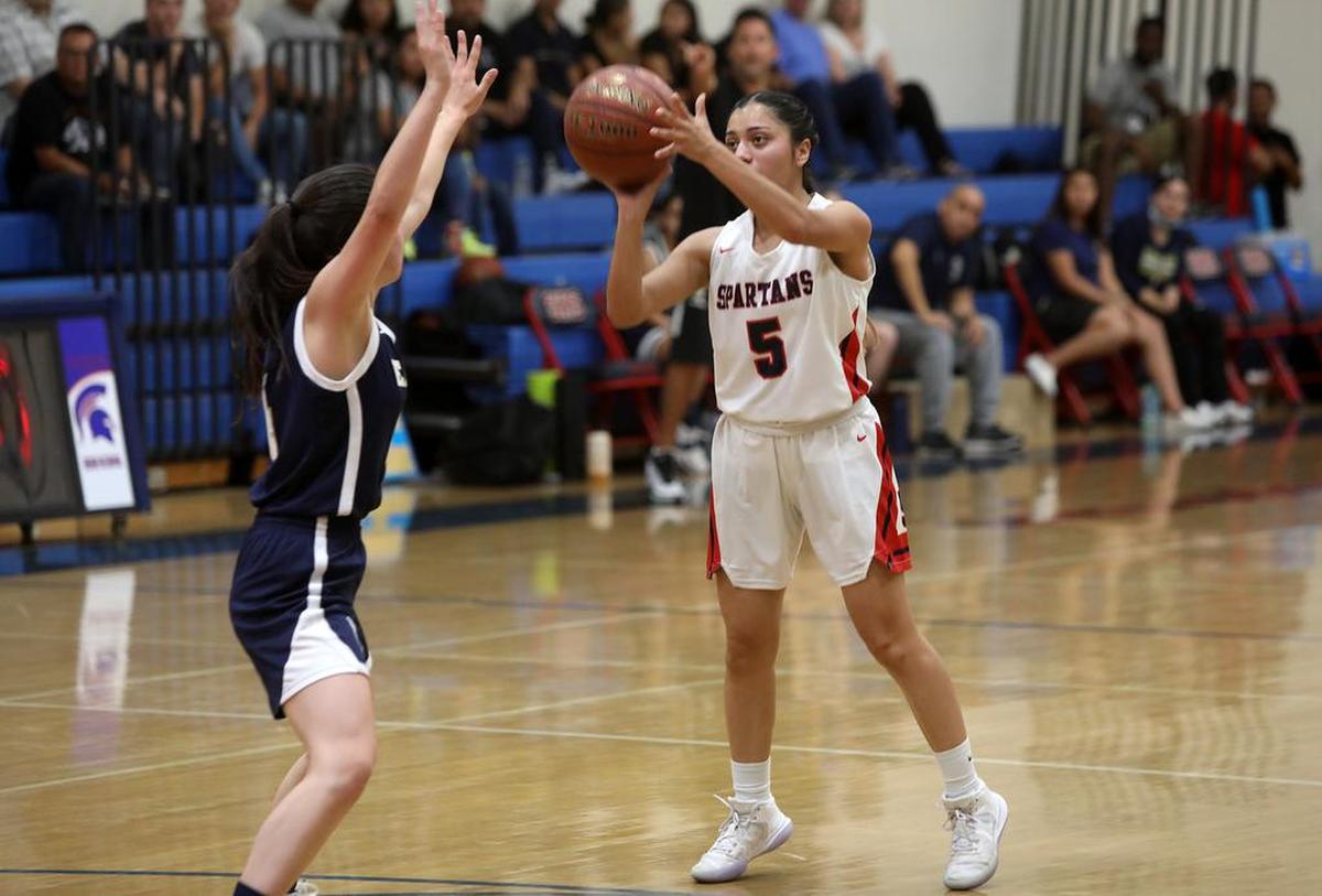 Strathmore High junior Erika Muñoz scores one of her five 3-point shots against Calvary Chapel in a Southern Section Division V-AA playoff win, 78-20, on June 15, 2021. She finished with 15 points.