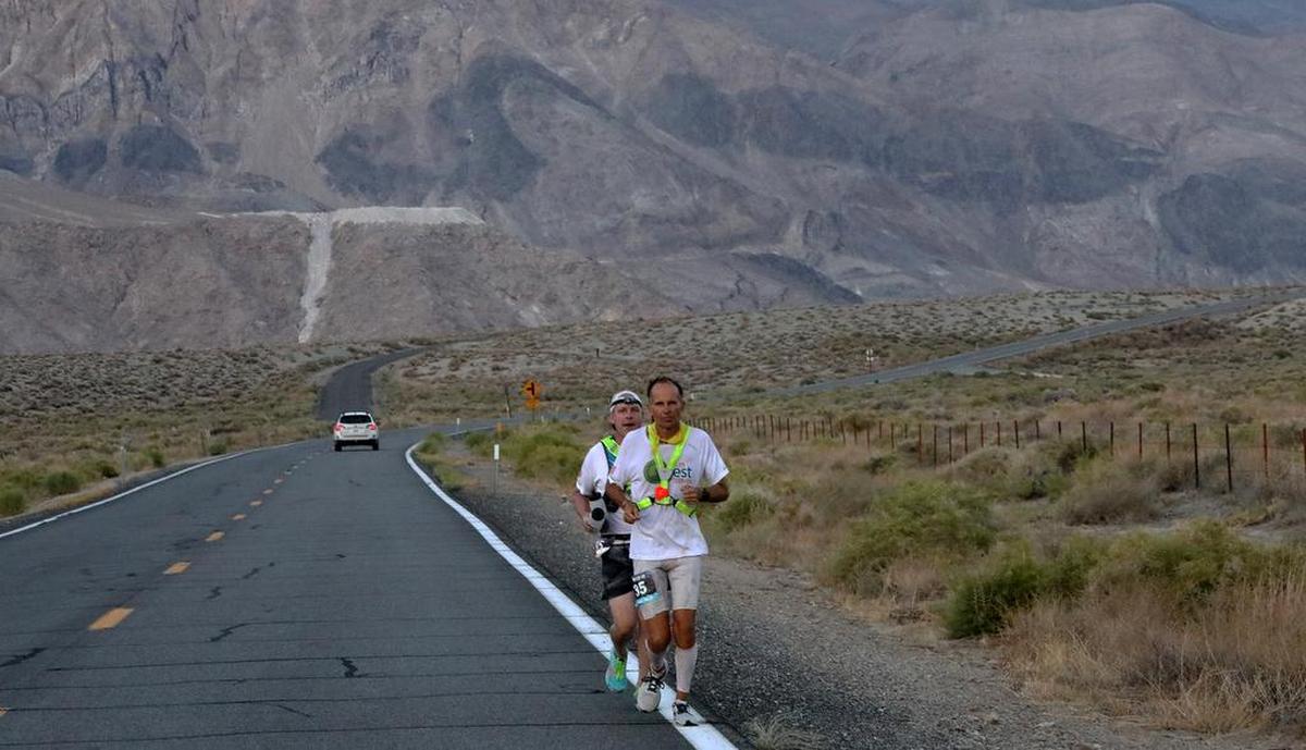 Harvey Lewis of Ohio and his pacer head toward Lone Pine on July 20, 2021. The 45-year-old teacher won his second Badwater 135 in 25 hours, 50 minutes, 23 seconds.