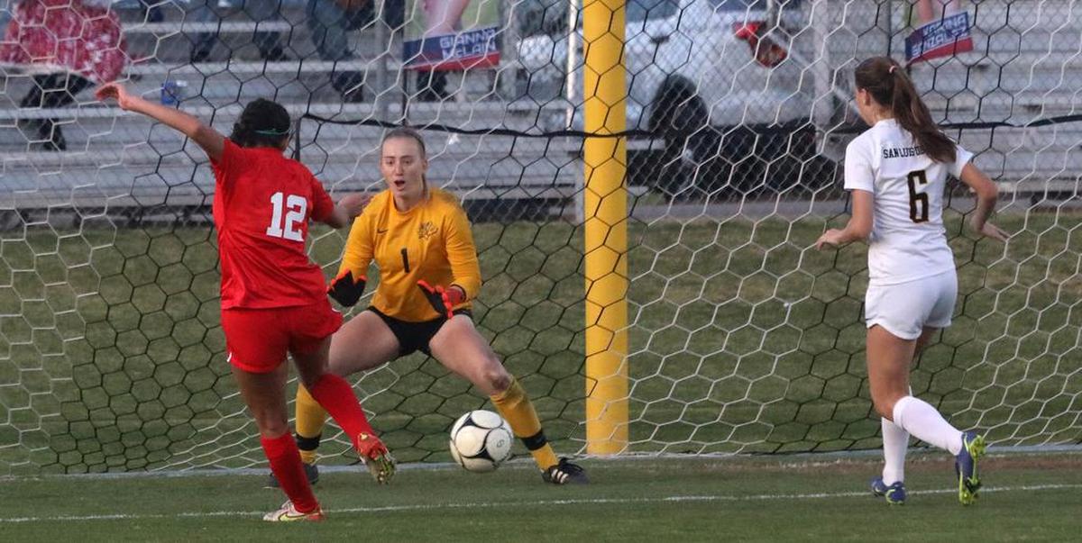 Sanger High senior Karina González slips a shot to the right side of the net that San Luis Obispo goalkeeper Riley Wilkerson could not stop in the final 5 minutes of the CIF Central Section Division II championship match at Tom Flores Stadium on Feb. 26, 2022. Sanger won, 2-0.