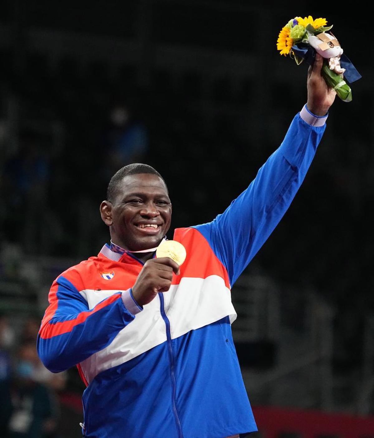 Gold medalist Mijaín López Núñez of Cuba poses on the podium after the men’'s Greco-Roman 130kg finals during the wrestling events of the Tokyo 2020 Olympic Games.