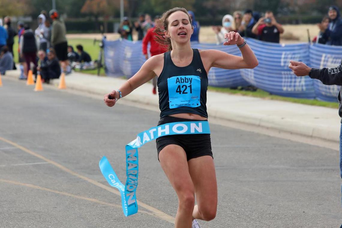 Two Cities Marathon women’s champion Abby Tempelsman crosses the finish in 3:04:19.7 on Nov. 7, 2021.