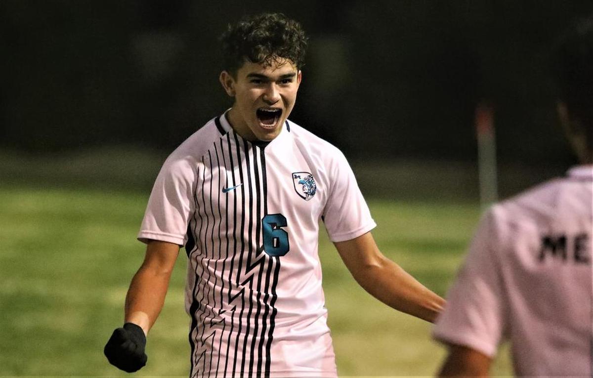 Mendota High juniro Amilcar Pineda celebrates his team’s 2-0 win over Riverdale High.
