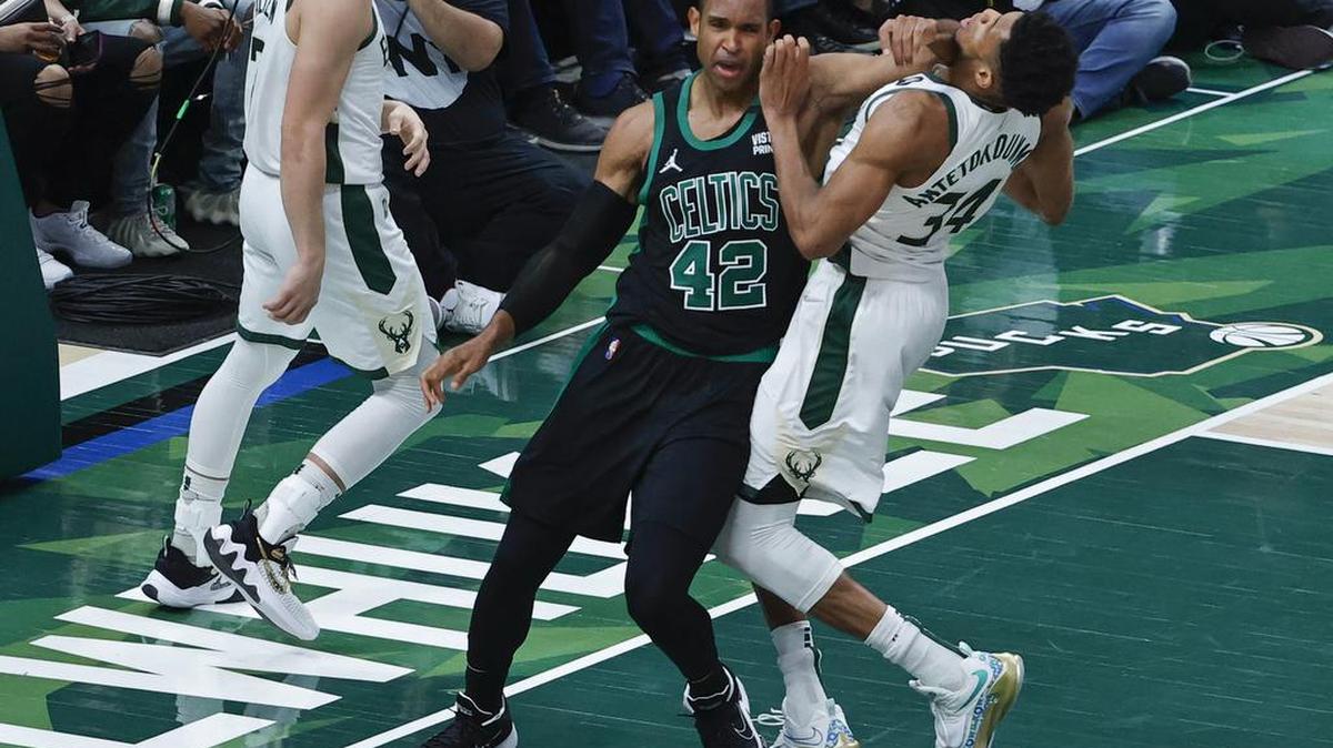 Boston Celtics center Al Horford commits a dead ball foul against Milwaukee Bucks forward Giannis Antetokounmpo after scoring during the second half of the NBA Eastern Conference semifinal playoff game four between the Milwaukee Bucs and Boston Celtics at Fiserv Forum, in Milwaukee, Wisconsin.