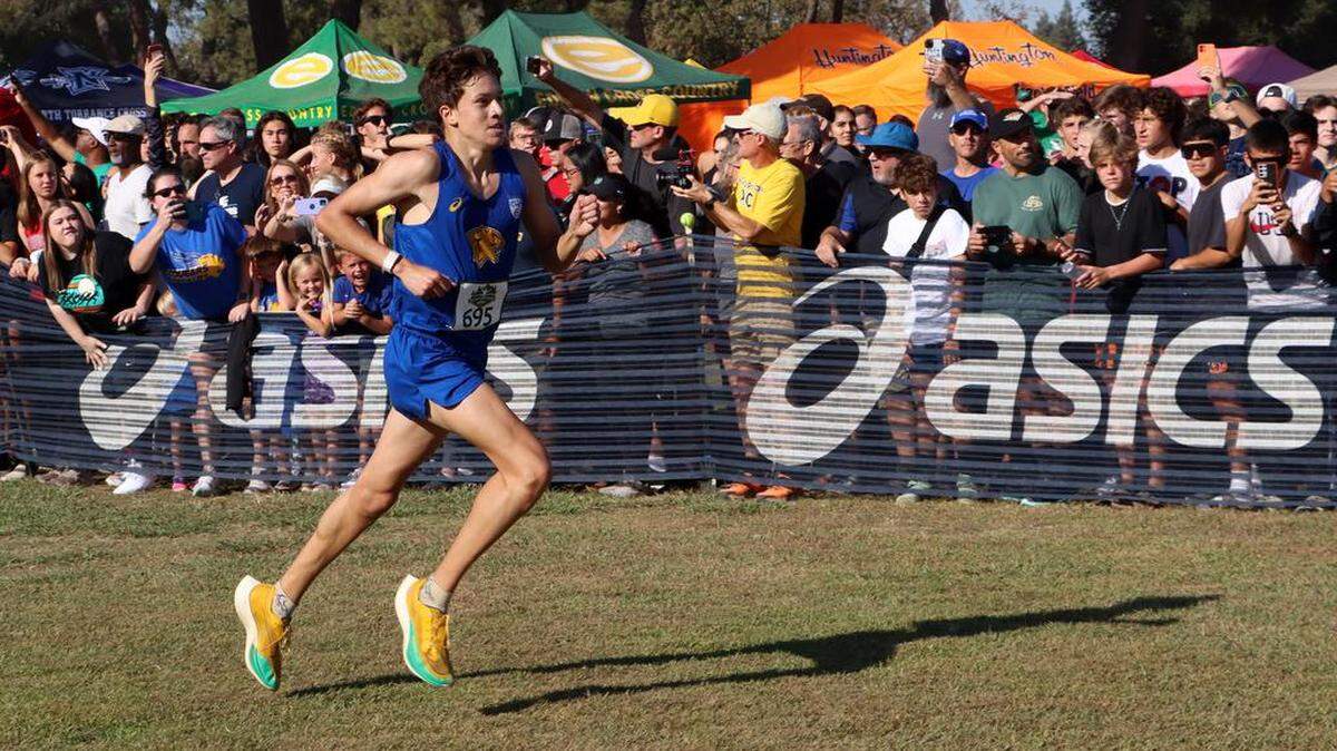 Clovis High senior Christopher Caudillo finished fourth (15:03.9) in the boys championship race of the 43rd Asics Clovis Invitational at Woodward Park on Oct. 8, 2022.