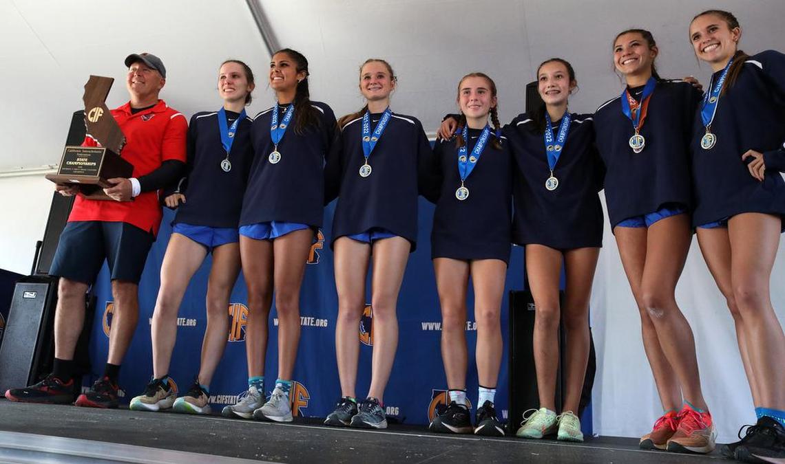 The Buchanan High girls cross country team, coached by Brian Weaver, won its second consecutive girls Division I state title at Woodward Park on Nov. 27, 2021.