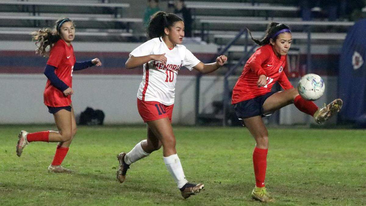 Ava Martínez of Sanger controls the ball against the defense of Mía Valdez of San Joaquín Memorial during a Jan. 27, 2023 CMAC match at Tom Flores Stadium. Sanger won, 4-2, to improve to 5-0-1 in league play.