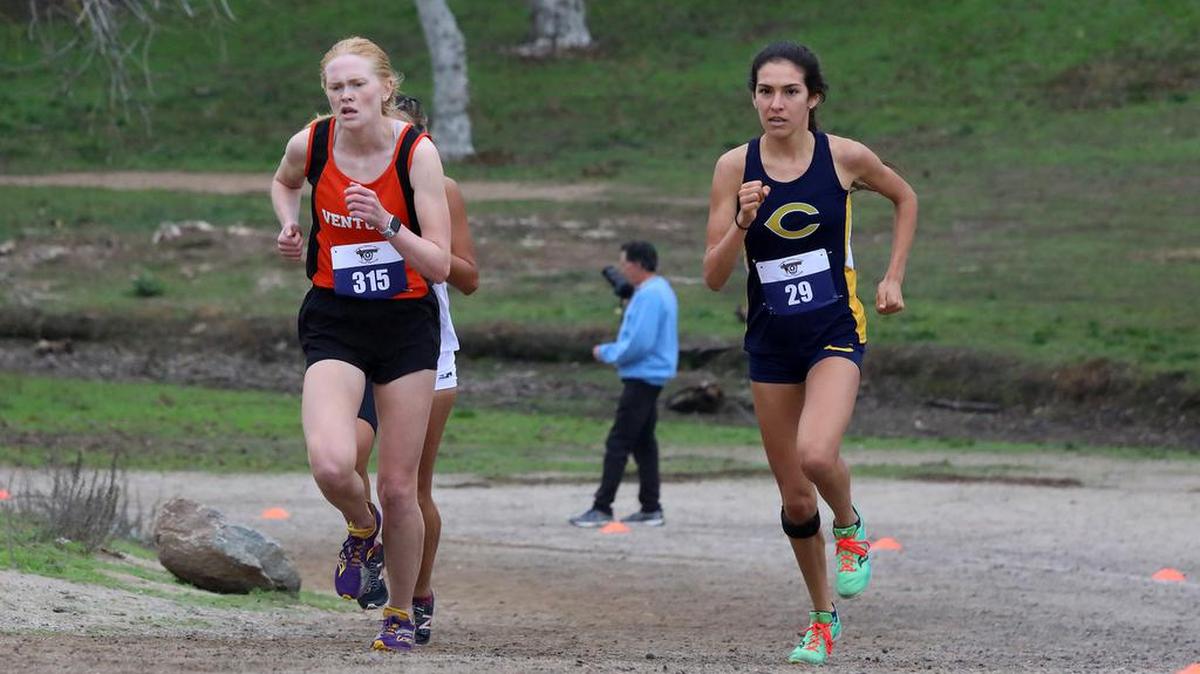 Ventura College freshman Stina Johansson (3rd, 18:13.8) and Canyons freshman Danielle Salcedo (1st, 17:54.9) run neck and neck on the Woodward Park 5-kilometer course during the California Community College state cross country championship on Nov. 20, 2021.Rivers