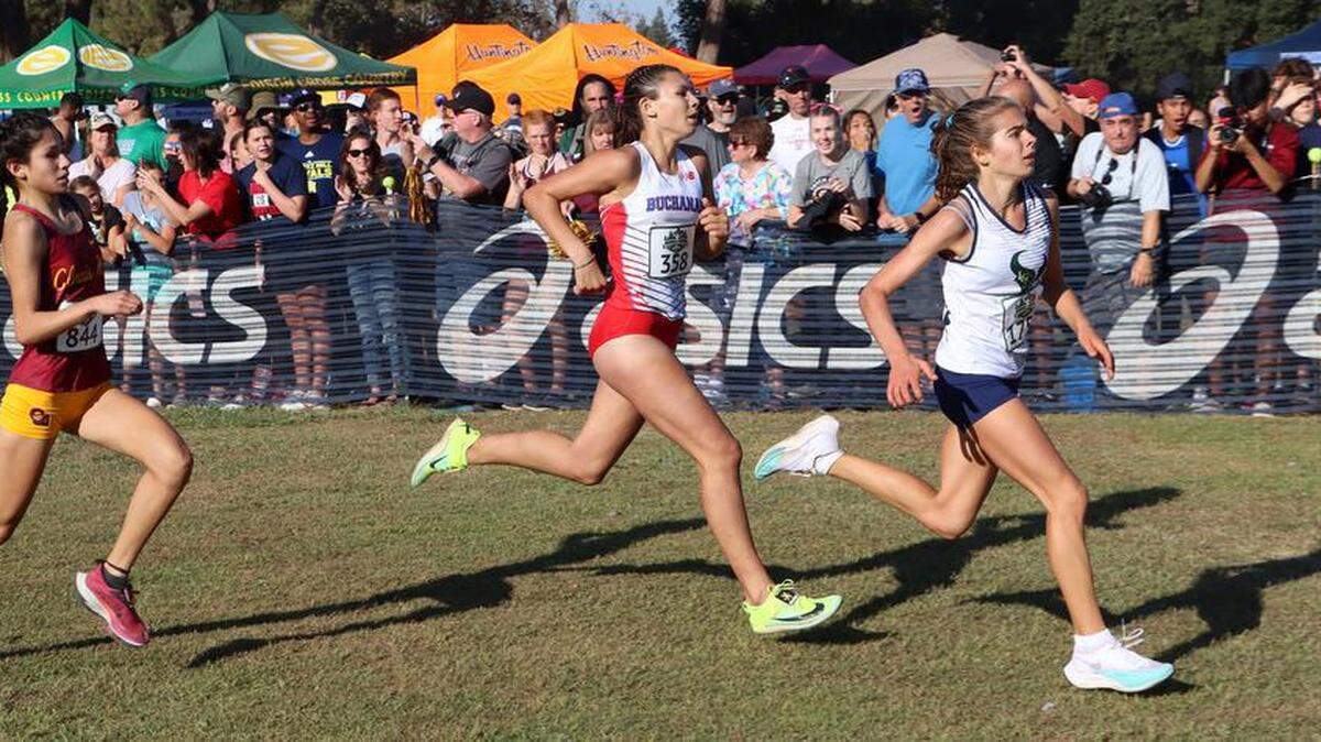 La Costa Canyon junior Gioana Lopizzo (17:28.0) finished ahead of Buchanan High sophomore Elliana Lomelí (17:28.1) and Clovis West freshman Cameron Macías (17:28.5) in the girls championship race of the 43rd Asics Clovis Invitational at Woodward Park on Oct. 8, 2022.