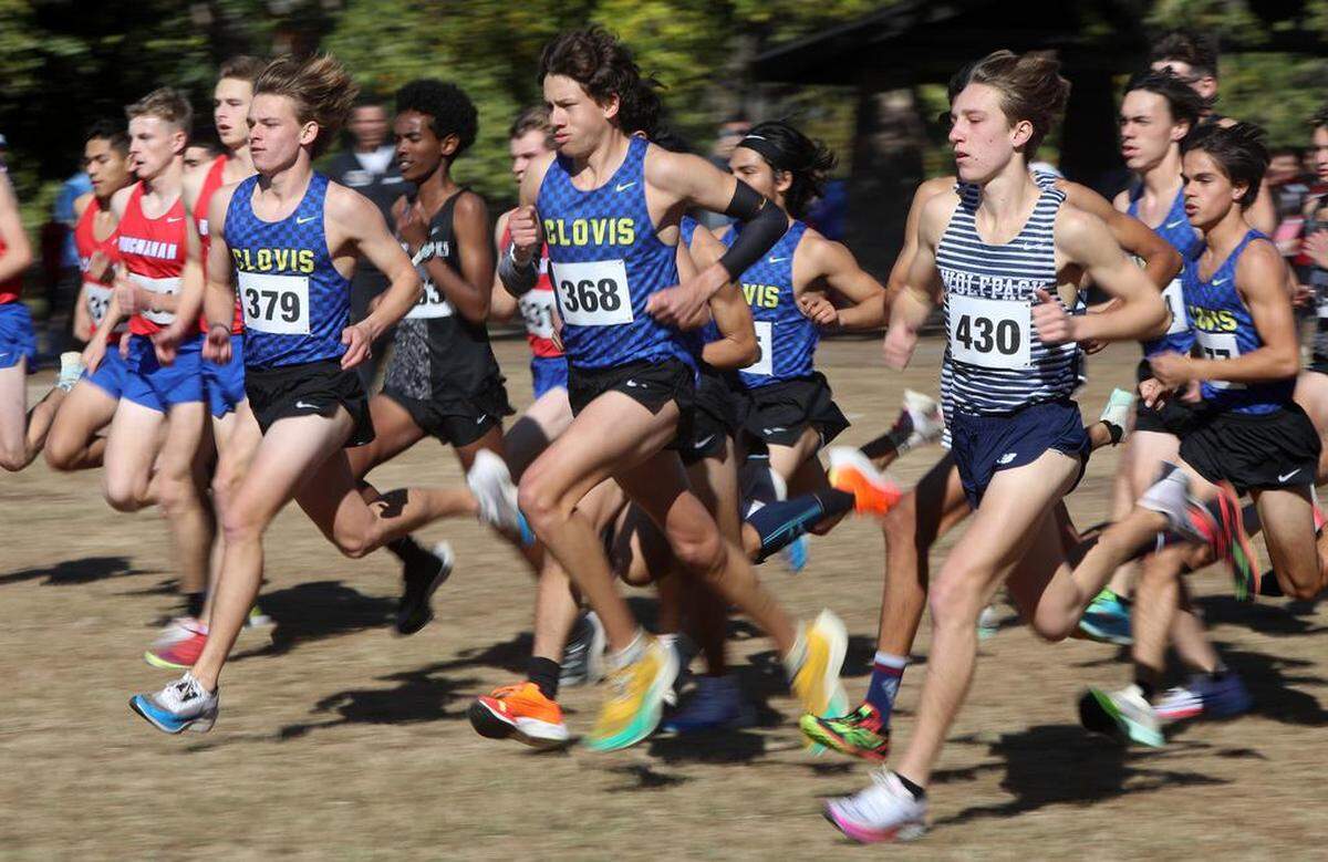 Clovis High senior Christopher Caudillo and Clovis East junor Carter Spaulding get off to a fast start on Nov. 11, 2022 at the TRAC meet at Woodward Park. Caudillo won with a time of 15:04.85. Spaulding was second in 15:29.32.