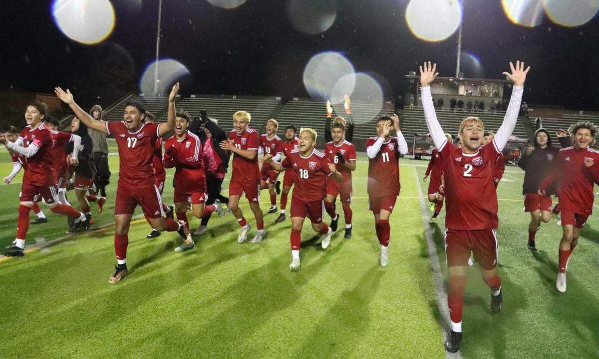 The No. 2-seeded McLane High boys celebrated their 0-0 (5-3 penalty kicks) win over Lincoln High of San José in the opening round of the CIF Northern Regional Division III soccer playoffs on a wet and windy Feb. 28, 2023 match at McLane High Stadium.