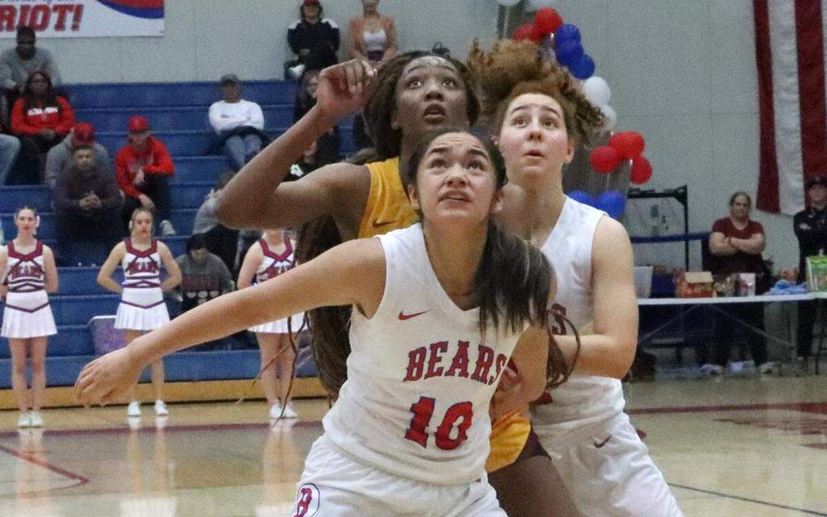 Buchanan High Kalena Tauiliili positions herself for a rebound in front of Clovis West senior Etoyah Montgomery in a TRAC girls basketball showdown Friday night. In the back is Buchanan junior Vanna Quintana.