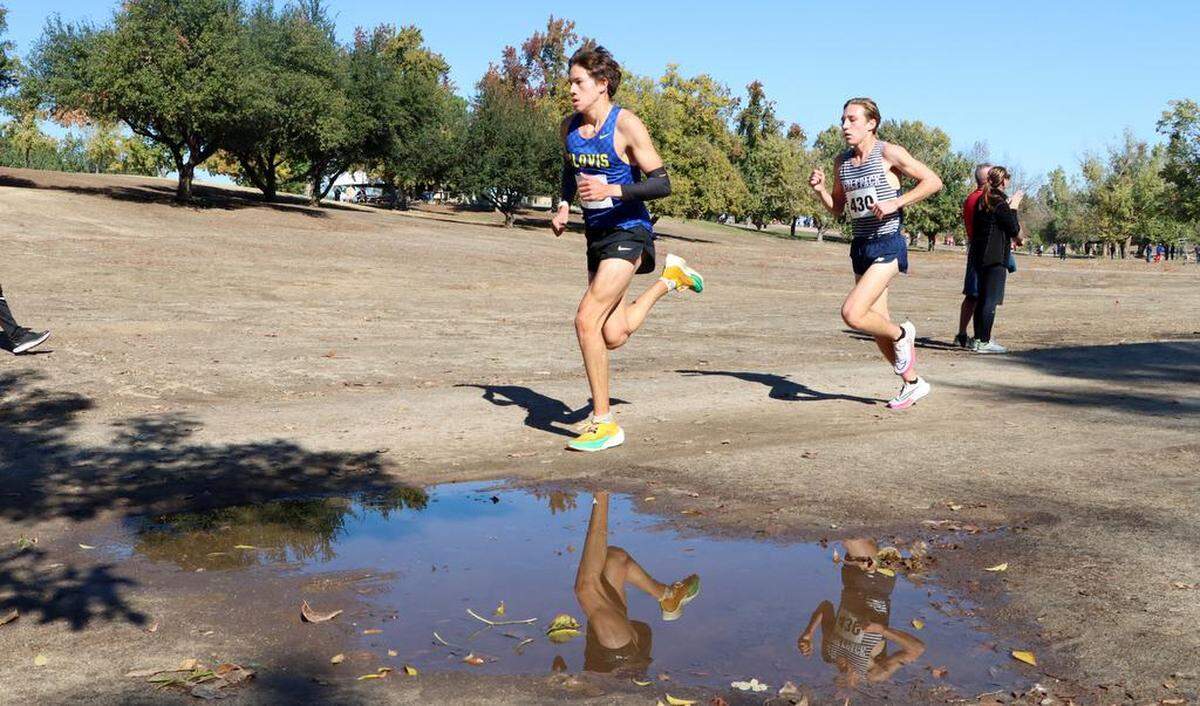 Clovis High senior Christopher Caudillo leads Clovis East junor Carter Spaulding past the 2-mile mark on Nov. 11, 2022 to win the TRAC individual title with a time of 15:04.85. Spaulding was second in 15:29.32.