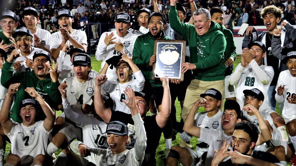 The Reedley High boys soccer team celebrates its 1-0 win over host Sanger High that won it the CIF Central Section Division I championship on Feb. 25, 2022.
