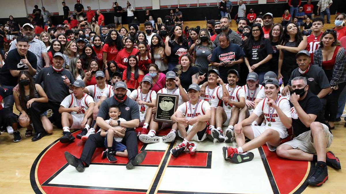 The Family – the name given to the Fowler High basketball team and supporters – celebrate a 59-55 win over Sierra High for the CIF Central Section Division V championship.