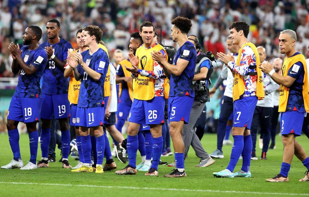 Americanplayers applaud fans after winning the FIFA World Cup 2022 group B soccer match between Iran and the USA at Al Thumama Stadium in Doha, Qatar.