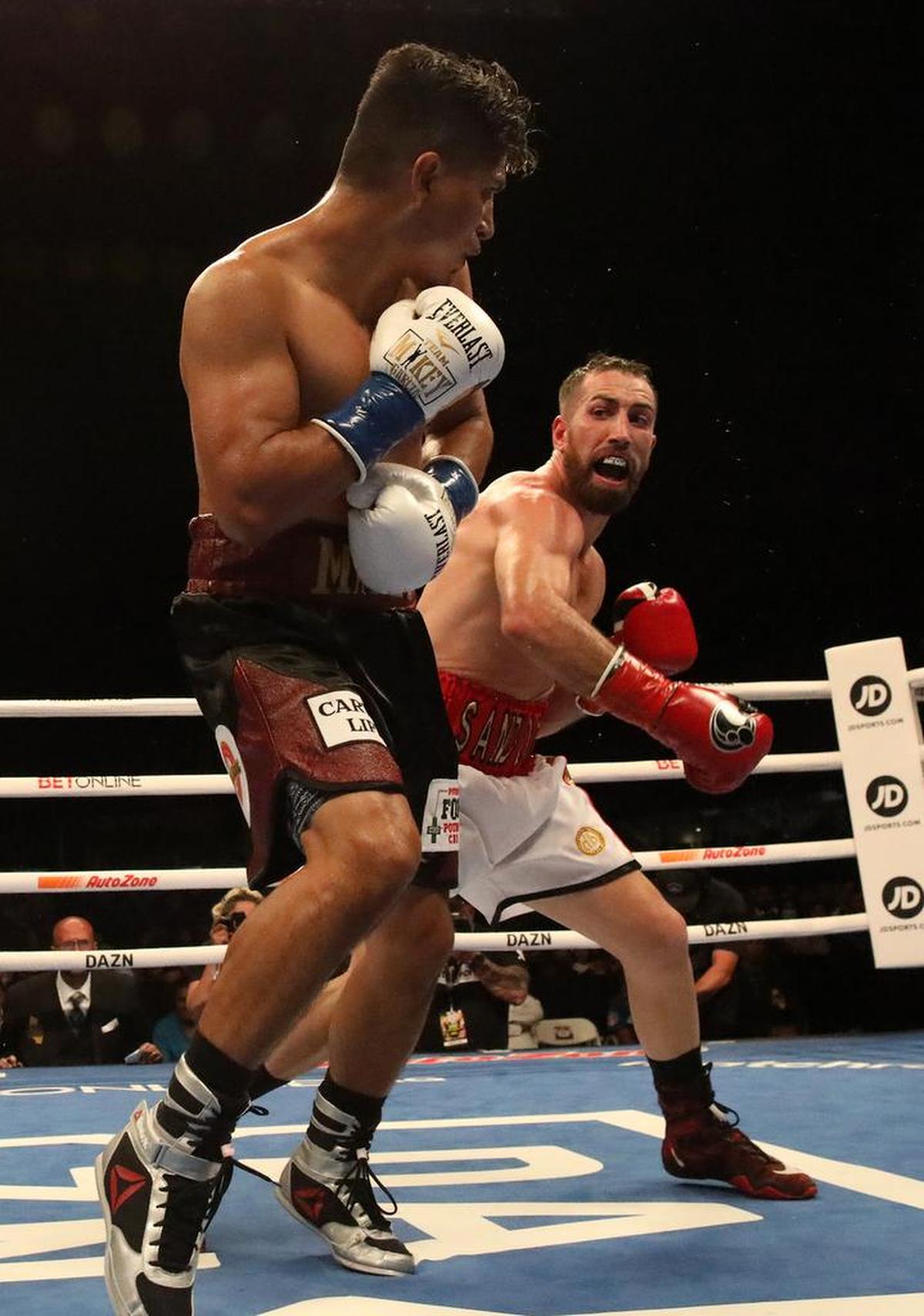 Sandor Martín of Barcelona, Spain tangles with Mikey García during their 10-round welterweight bout at Chukchansi Park on Oct. 16. 2021. Martín scored a split decision win over the four-time world champion in a shocking result. Martín improved to 39-2; García, from Oxnard, dropped to 40-2.