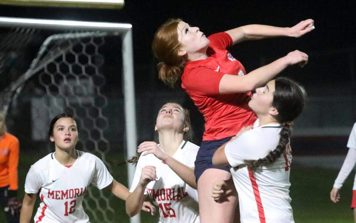 Corynn Bravo of Sanger leaps above the San Joaquín Memorial defense for a header during a Jan. 27, 2023 CMAC match at Tom Flores Stadium. Sanger won, 4-2, to improve to 5-0-1 in league play.