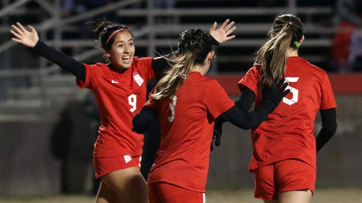 Fowler High senior Damaris López rushes to congratulate junior teammate Katelyn Shoopman on her first-half goal against Reedley High during a CIF Central Section Division IV girls soccer match on Feb. 15, 2023 at Fowler High. López scored two goals in the 5-0 win by Fowler.