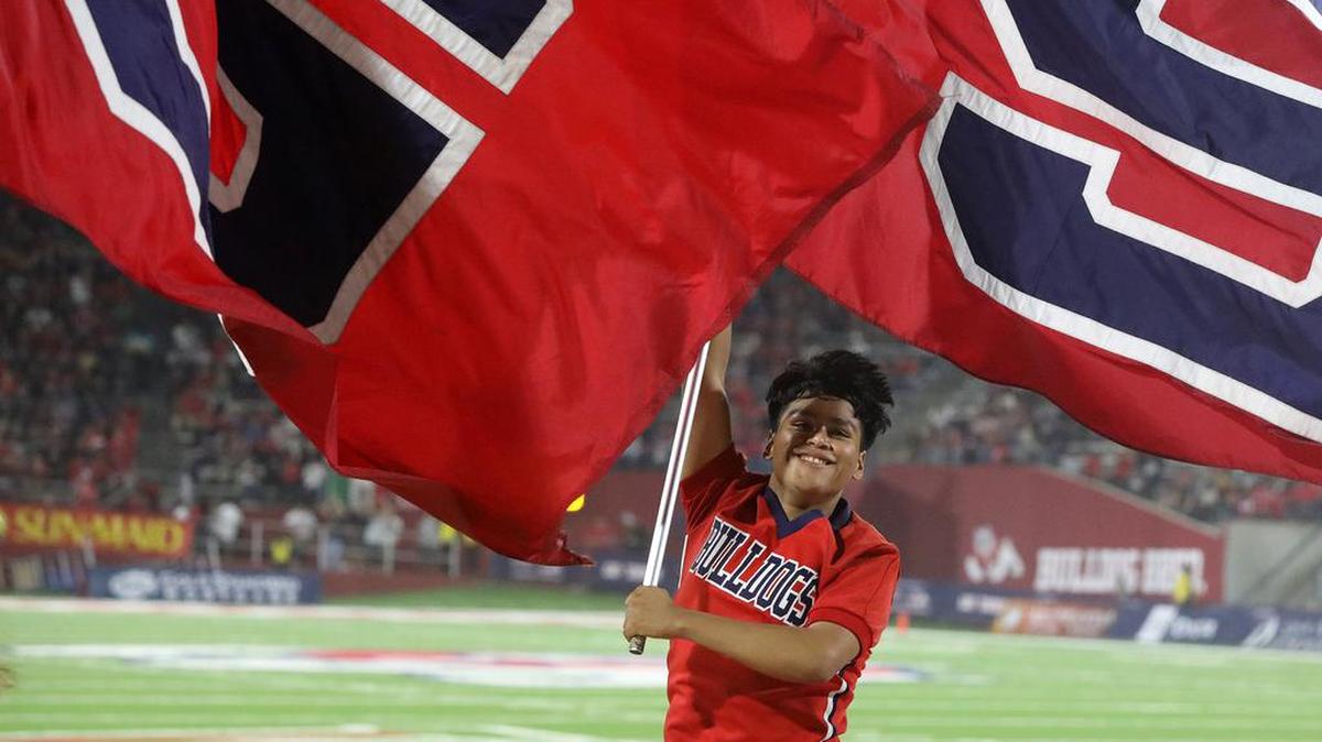 A member of the Fresno State dance team celebrates a touchdown during a 38-30 win by the Bulldoags over UNLV on Sept. 24, 2021.