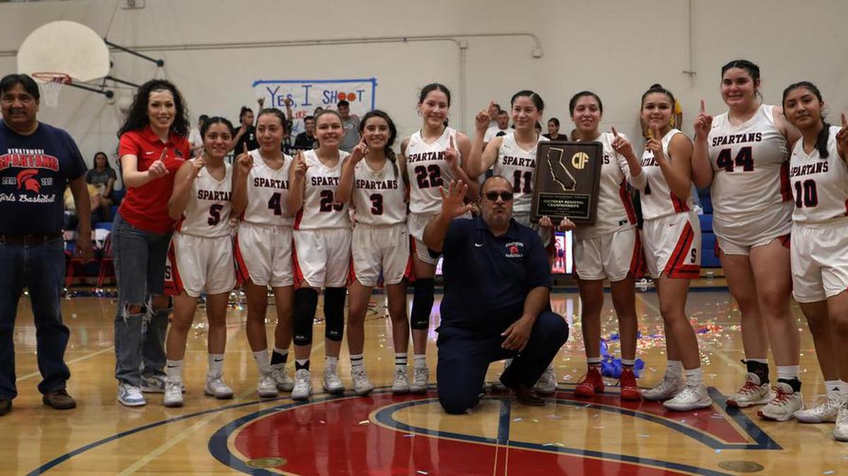 The Strathmore High girls basketball team celebrates after its 63-54 win over Fallbrook High for the CIF Southern Section Division V-AA championship on June 19, 2021.