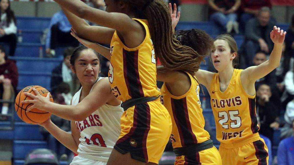 Buchanan High senior Kalena Tauiliili finds herself surrounded by Clovis High players during a TRAC girls basketball game on Jan. 20, 2023.