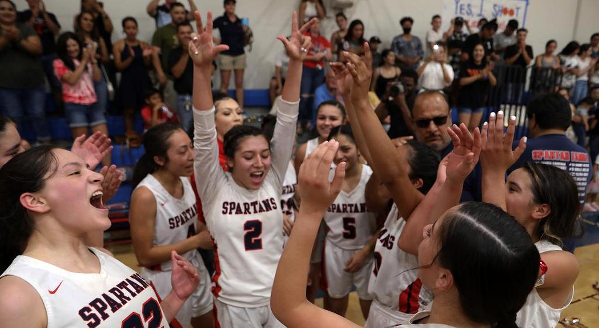 The Strathmore High girls basketball team celebrates after its 63-54 win over Fallbrook High for the CIF Southern Section Division V-AA championship on June 19, 2021.