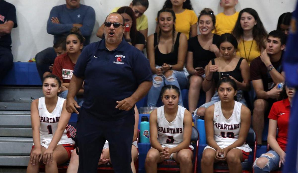 Strathmore High girls basketball coach Richard Miranda yellos out instructions in guiding his team to the CIF Central Section Dvision V title with a 73-60 win over Corcoran High on June 10, 2021.