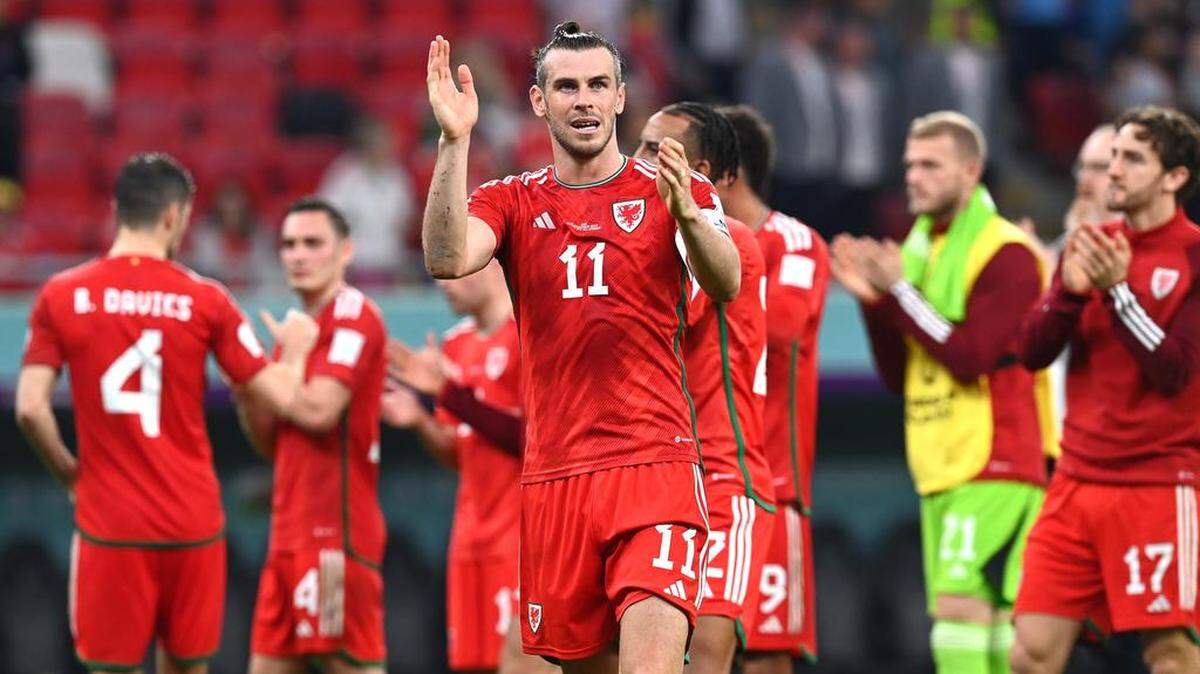 Gareth Bale of Wales and teammates applaud fans after the FIFA World Cup 2022 group B soccer match between the USA and Wales at Ahmad bin Ali Stadium in Doha, Qatar.