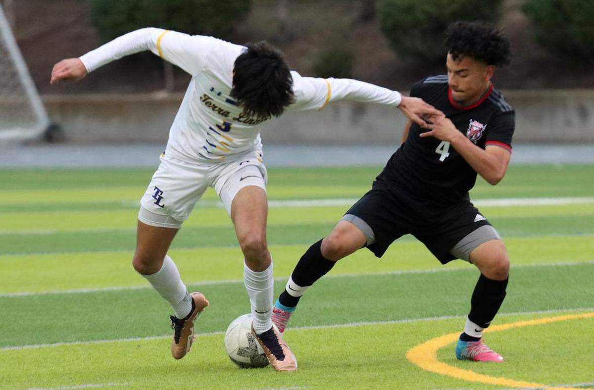 McLane High sophomore Daniel Contreras tries to take the ball away from Terra Linda senior Liam Hadden during the Northern California Division III boys championship match March 4 at McLane High Stadium. Terra Linda won, 2-0.
