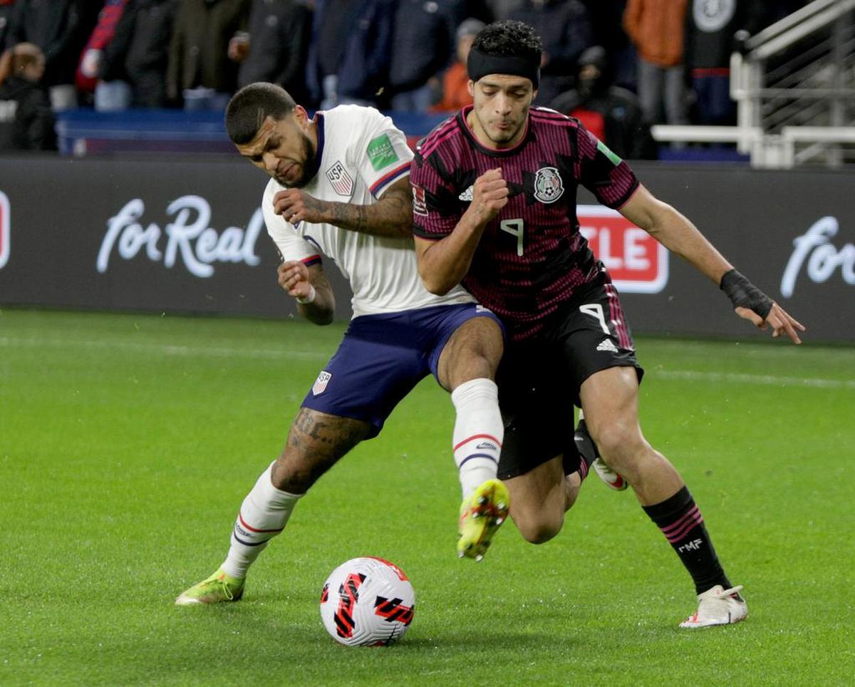 DeAndre Yadlin of the USA in action against Raúl Jiménez of México during the CONCACAF World Cup Qatar 2022 qualifier soccer match between the USA and México.