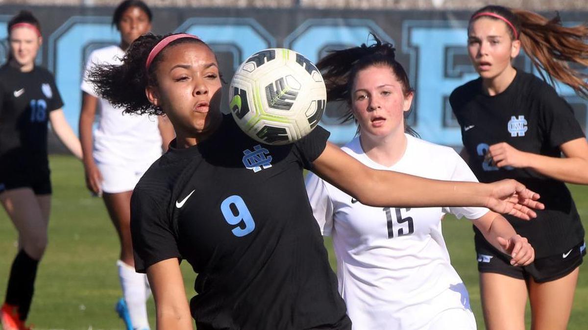 Clovis North senior forward Cadence Whitley keeps her eye on the ball during a CIF Central Section girls Division I soccer match.