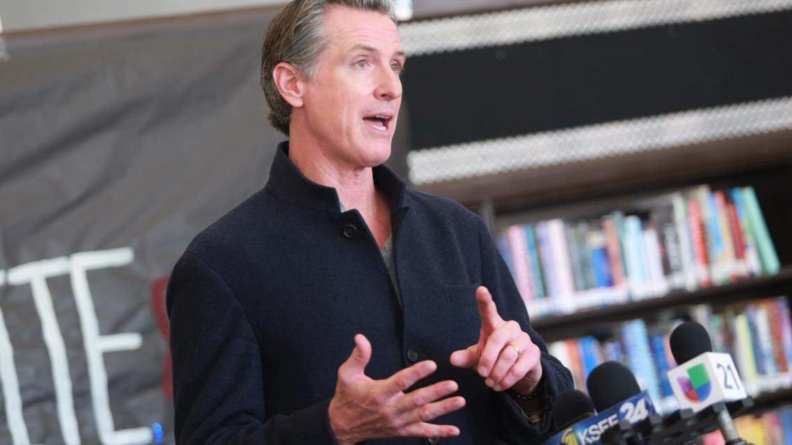 Gov. Gavin Newsom talks to media as he promotes COVID-19 vaccination and booster shots in Avenal.