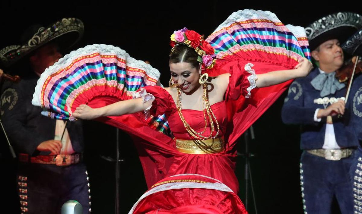 A folkloric dancer performs with Mariachi Vargas de Tecalitlán during the 'Ay Amor! Serenata Pa'l Corazón' mariachi festival at the Save Mart Center on May 7, 2022.