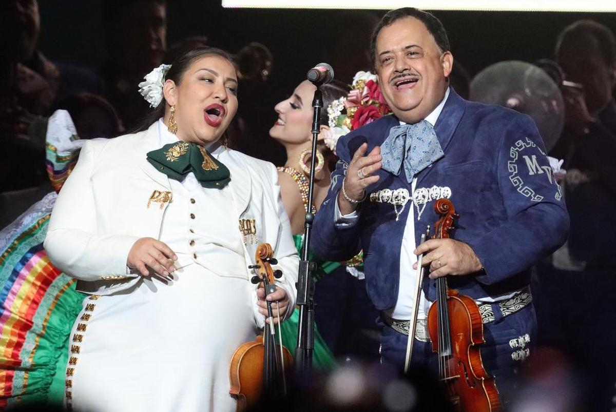 Violinists from Mariachi Divas de Cindy Shea and Mariachi Vargas de Tecalitlán perform 'El Son de la Negra' in the finale of the 'Ay Amor! Serenata Pa'l Corazón' mariachi festival at the Save Mart Center on May 7, 2022.