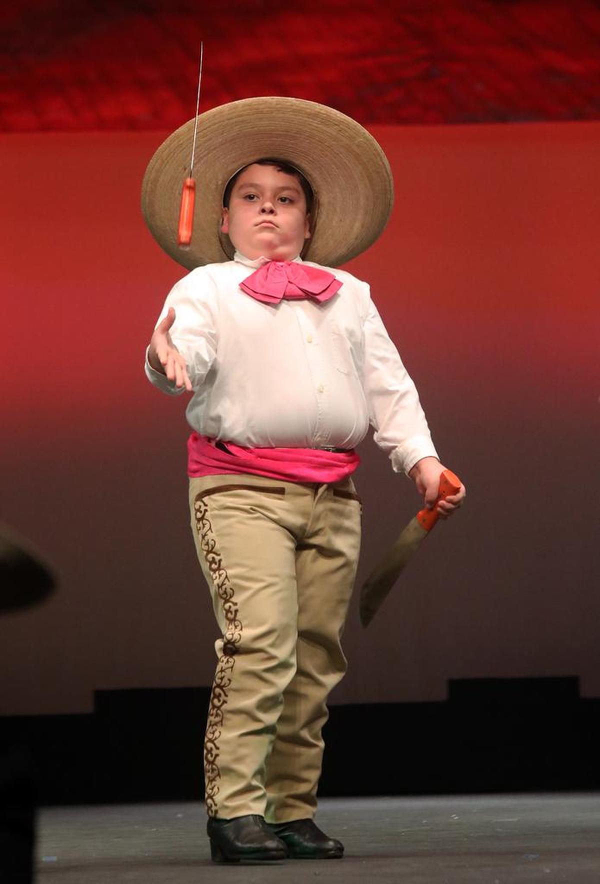 A boy from Compañía de Danza El Sol performs a dance from Jalisco.