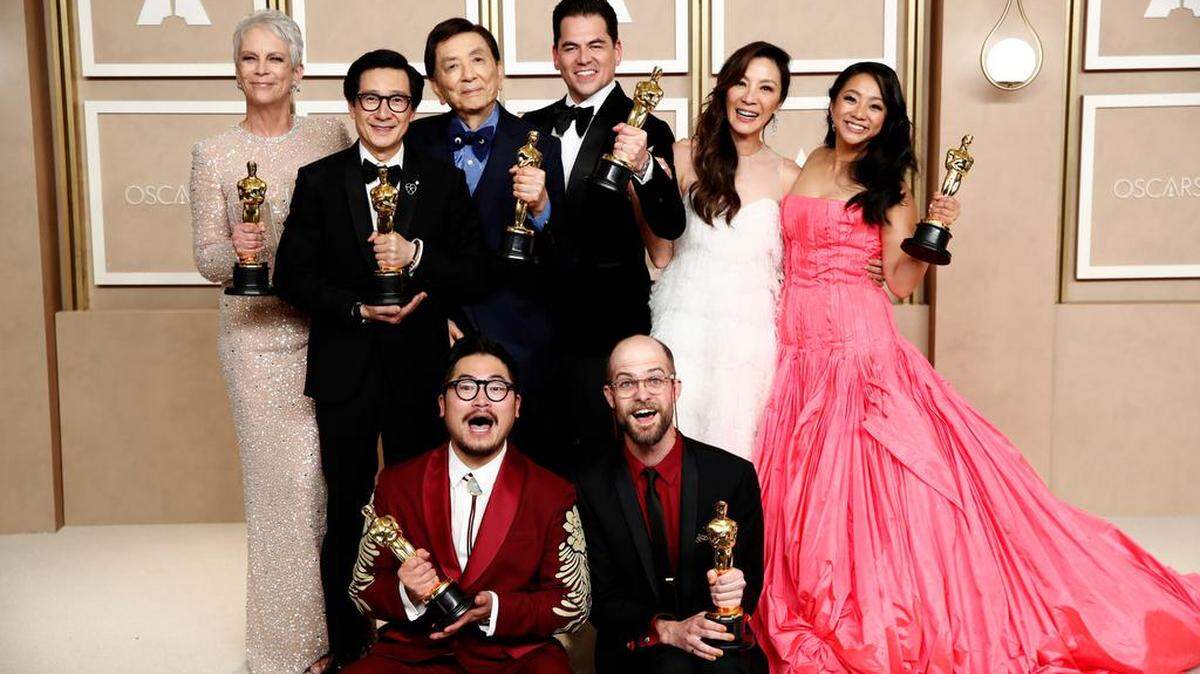 Jamie Lee Curtis, winner of the Best Supporting Actress award, Ke Huy Quan, winner of the Best Actor In A Supporting Role award, James Hong, Jonathan Wang, winner of the Best Picture award, Michelle Yeoh, winner of the Best Actress in a Leading Role award, Stephanie Hsu and (L-R bottom row) Dan Kwan and Daniel Scheinert, winners of the Best Director and Best Picture award for ‘Everything Everywhere All at Once,’ pose in the press room during the 95th annual Academy Awards ceremony at the Dolby Theatre in Hollywood.