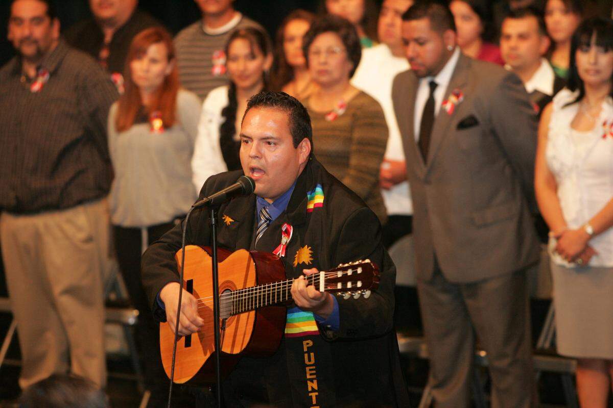 FCC LATINO GRADUATION JE VDA 05/11/10 FRESNO CITY COLLEGE THEATRE - Scenes from the seventh annual Latino Graduation Ceremony for Fresno City College graduates. FCC graduate Raoul Javier Hernández sang the Mexican national anthem.