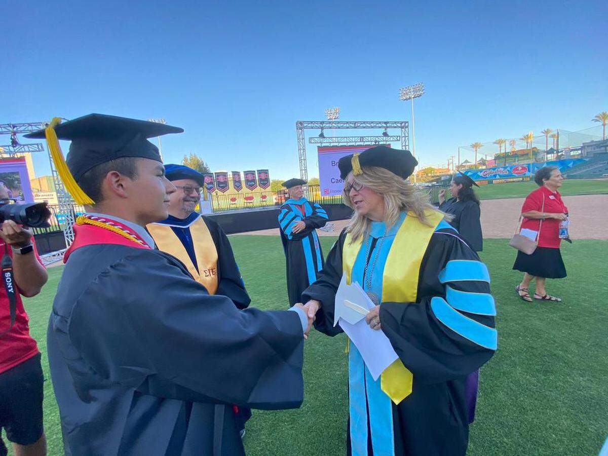 This year’s 2021 FCC Dean’s Medallion Award recipient Sylas Ramos, with President Dr. Carole Goldsmith before the start of the June 23 outdoors commencement at Chukchansi Park in downtown Fresno. Ramos was chosen by Goldsmith to receive this year’s Tony Cantú President’s Medallion.