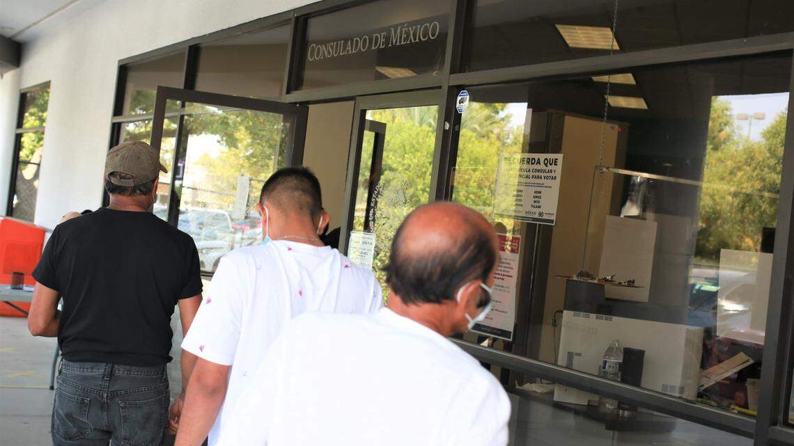 Mexican nationals with appointments await their turn to enter the facilities of the Consulate of Mexico in Fresno on August 25. The consulate this month fired a security guard and two employees involved in a appointments sales scam. Consulate is looking for additional victims.