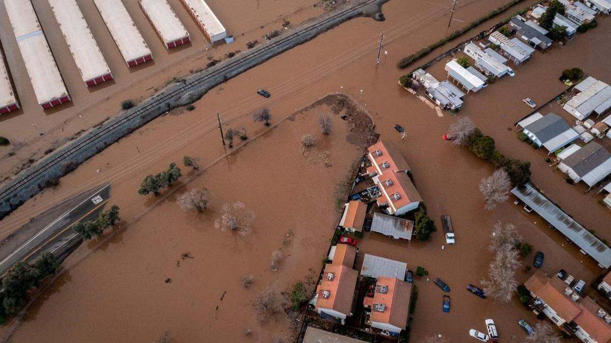 Properties along Beer Creek were flooded after another wave of storms in Merced, California. Many California counties are under flood warnings.