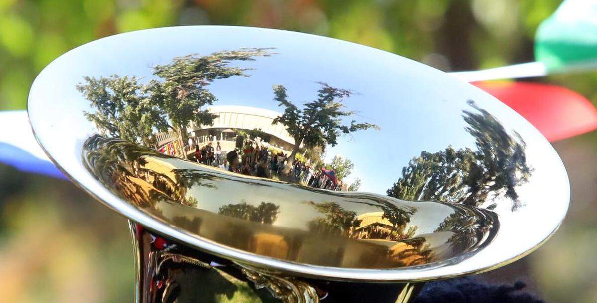 The Kennel Bookstore is reflected off a horn played by Mariachi Orgullo Fresno State at the Sept. 21, 2022 Bienvenida (Welcome) celebration.